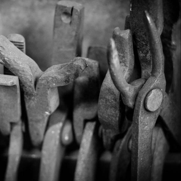 Greyscale close up photo of hand tools in the workshop